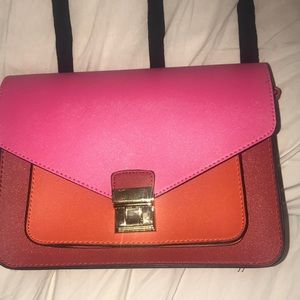 A pink/orange/red blocked color purse